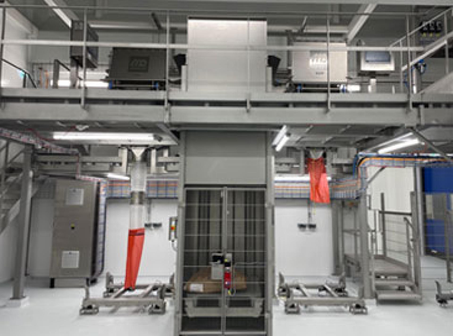 Two new tipping machines installed in a clean, bright room