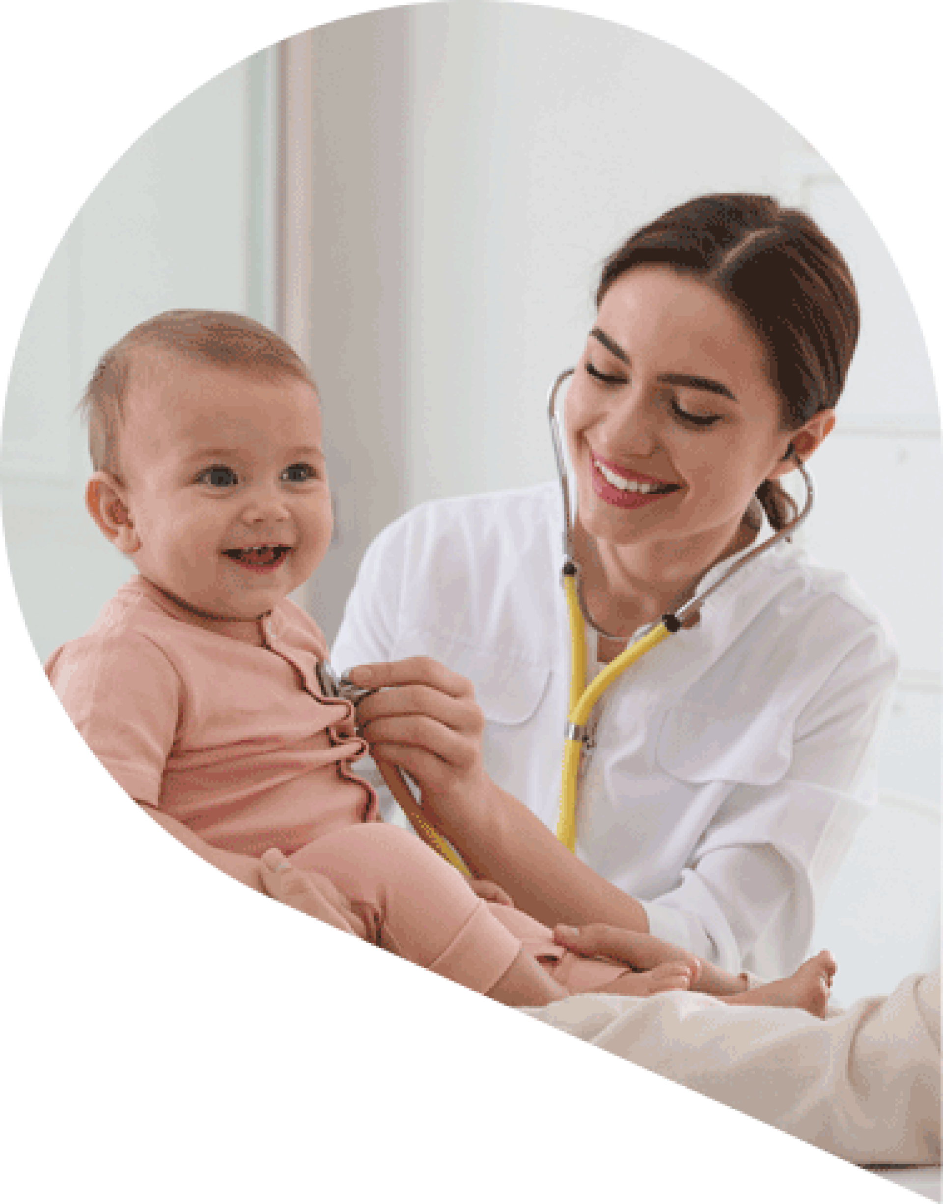 healthcare professional using a stethoscope to listen to the heart of a smiling child