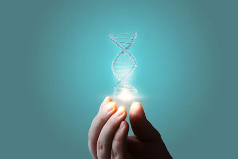 DNA helix being held on a teal background
