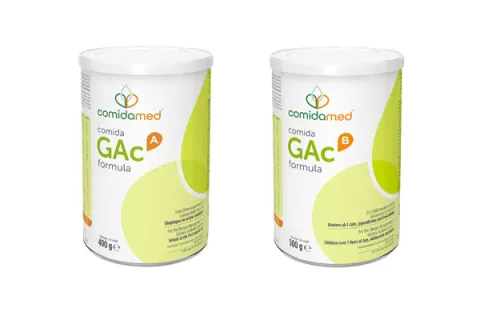 Two cans one of comida-GAc A formula, the other comida-GAc B formula