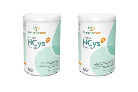 Two cans showing comida-HCys A formula and comida-HCys B formula products