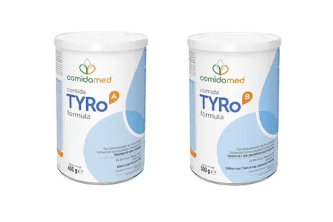 Two cans one showing comida-TYRo A formula,  the other comida-TYRo B formula